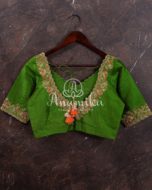 Kanjeevaram saree in a unique shade of light orangish yellow with green blouse