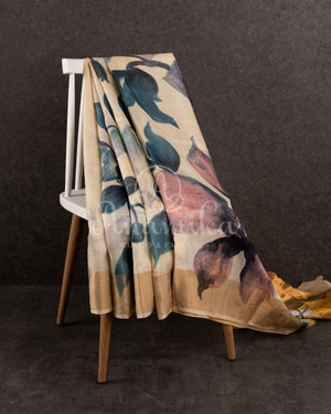 Tussar Saree with handpainting floral design, paired with peacock blue ikkat rawsilk blouse