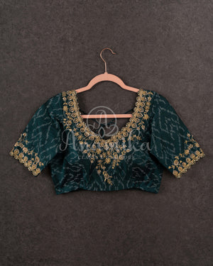 Tussar Saree with handpainting floral design, paired with peacock blue ikkat rawsilk blouse