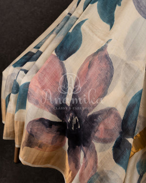 Tussar Saree with handpainting floral design, paired with peacock blue ikkat rawsilk blouse