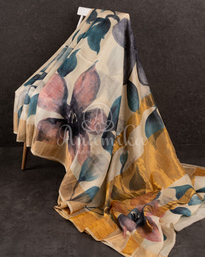 Tussar Saree with handpainting floral design, paired with peacock blue ikkat rawsilk blouse