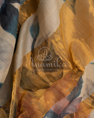 Tussar Saree with handpainting floral design, paired with peacock blue ikkat rawsilk blouse