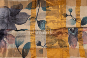 Tussar Saree with handpainting floral design, paired with peacock blue ikkat rawsilk blouse