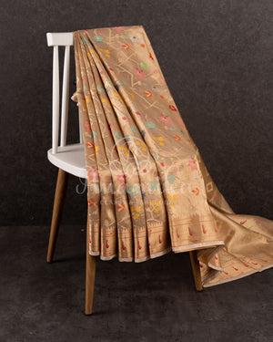 Beige zari kota saree with all over jaal design and muniya inspired border