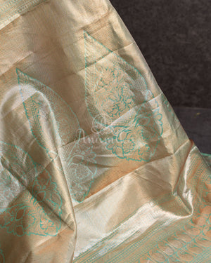 Tissue Kanjeevaram saree in light pastel blue paired with a contrast pink mirror work blouse