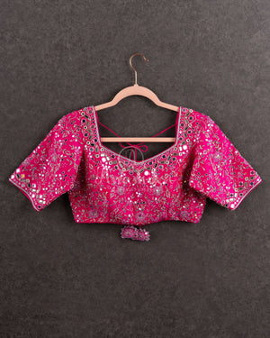 Tissue Kanjeevaram saree in light pastel blue paired with a contrast pink mirror work blouse