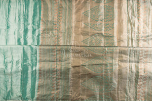 Tissue Kanjeevaram saree in light pastel blue paired with a contrast pink mirror work blouse