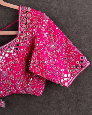 Tissue Kanjeevaram saree in light pastel blue paired with a contrast pink mirror work blouse