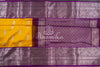 A traditional venkatagiri pattu saree in festive colors of yellow and purple