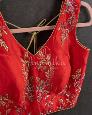 Red Floral Georgette ruffle saree with a stylish sleeveless blouse