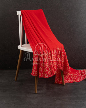 Red Floral Georgette ruffle saree with a stylish sleeveless blouse