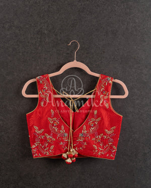 Red Floral Georgette ruffle saree with a stylish sleeveless blouse