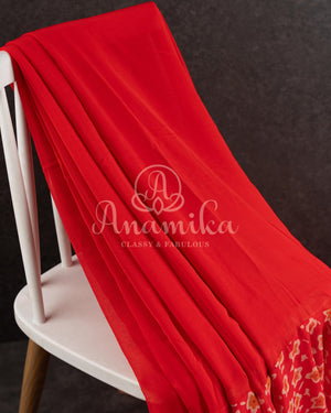 Red Floral Georgette ruffle saree with a stylish sleeveless blouse