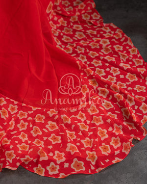 Red Floral Georgette ruffle saree with a stylish sleeveless blouse