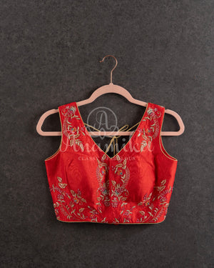 Red Floral Georgette ruffle saree with a stylish sleeveless blouse