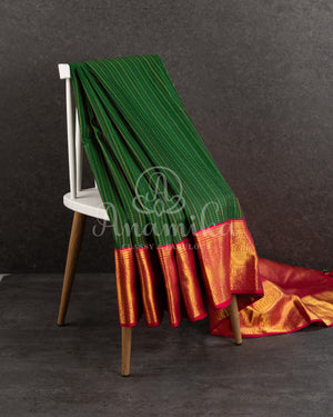 Dark Green Kanchipuram saree with contrast pink gold zari border