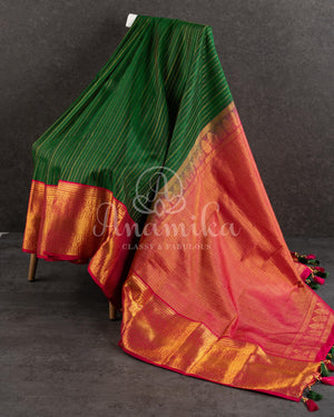 Dark Green Kanchipuram saree with contrast pink gold zari border