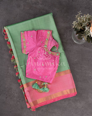 Pastel green soft silk kanchipuram saree with contrast pink border and blouse