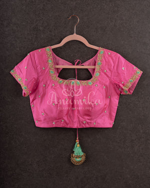 Pastel green soft silk kanchipuram saree with contrast pink border and blouse