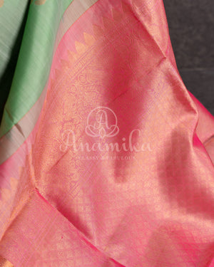 Pastel green soft silk kanchipuram saree with contrast pink border and blouse