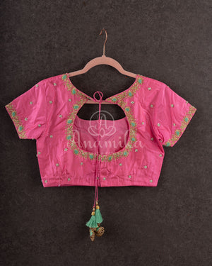 Pastel green soft silk kanchipuram saree with contrast pink border and blouse