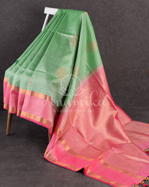 Pastel green soft silk kanchipuram saree with contrast pink border and blouse