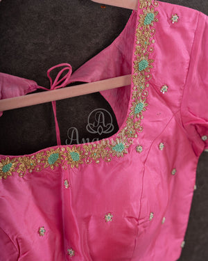 Pastel green soft silk kanchipuram saree with contrast pink border and blouse