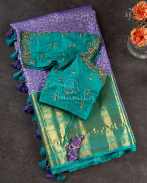 Lavender Kanchipattu saree with a contrast sky blue border and blouse