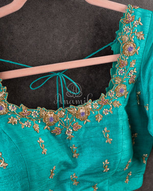 Lavender Kanchipattu saree with a contrast sky blue border and blouse