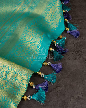 Lavender Kanchipattu saree with a contrast sky blue border and blouse