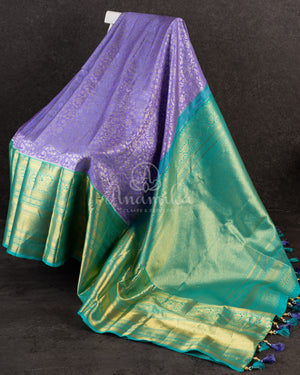 Lavender Kanchipattu saree with a contrast sky blue border and blouse