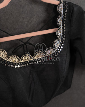 Black Pleated saree with an embroidered border and blouse