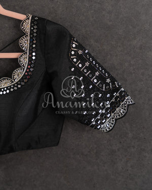 Black Pleated saree with an embroidered border and blouse