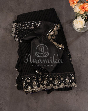 Black Pleated saree with an embroidered border and blouse