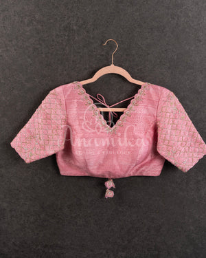 Peach Pink Pleated saree with an embroidered border and blouse