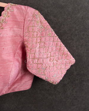 Peach Pink Pleated saree with an embroidered border and blouse