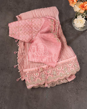Peach Pink Pleated saree with an embroidered border and blouse
