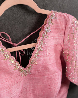 Peach Pink Pleated saree with an embroidered border and blouse