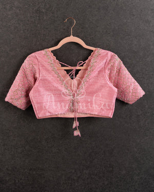 Peach Pink Pleated saree with an embroidered border and blouse