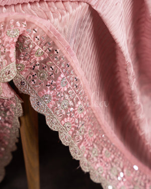 Peach Pink Pleated saree with an embroidered border and blouse