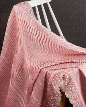 Peach Pink Pleated saree with an embroidered border and blouse