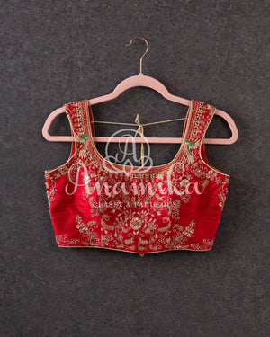 Red sleeveless blouse with all over gold work