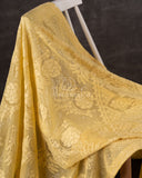 Chikankari georgette saree in yellow paired with a sleeveless off white blouse