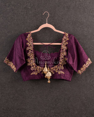 Kanjeevaram saree in Mauve/Plum combo with a grand border and pallu