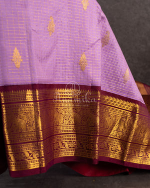 Kanjeevaram saree in Mauve/Plum combo with a grand border and pallu