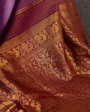 Kanjeevaram saree in Mauve/Plum combo with a grand border and pallu