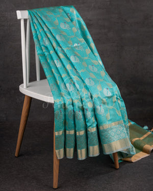 Chanderi Pattu saree in blue paired with a contrast pink brocade blouse