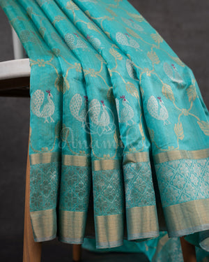 Chanderi Pattu saree in blue paired with a contrast pink brocade blouse