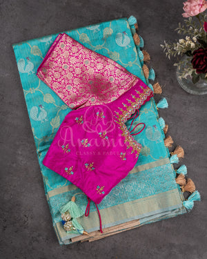 Chanderi Pattu saree in blue paired with a contrast pink brocade blouse