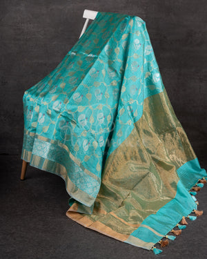 Chanderi Pattu saree in blue paired with a contrast pink brocade blouse